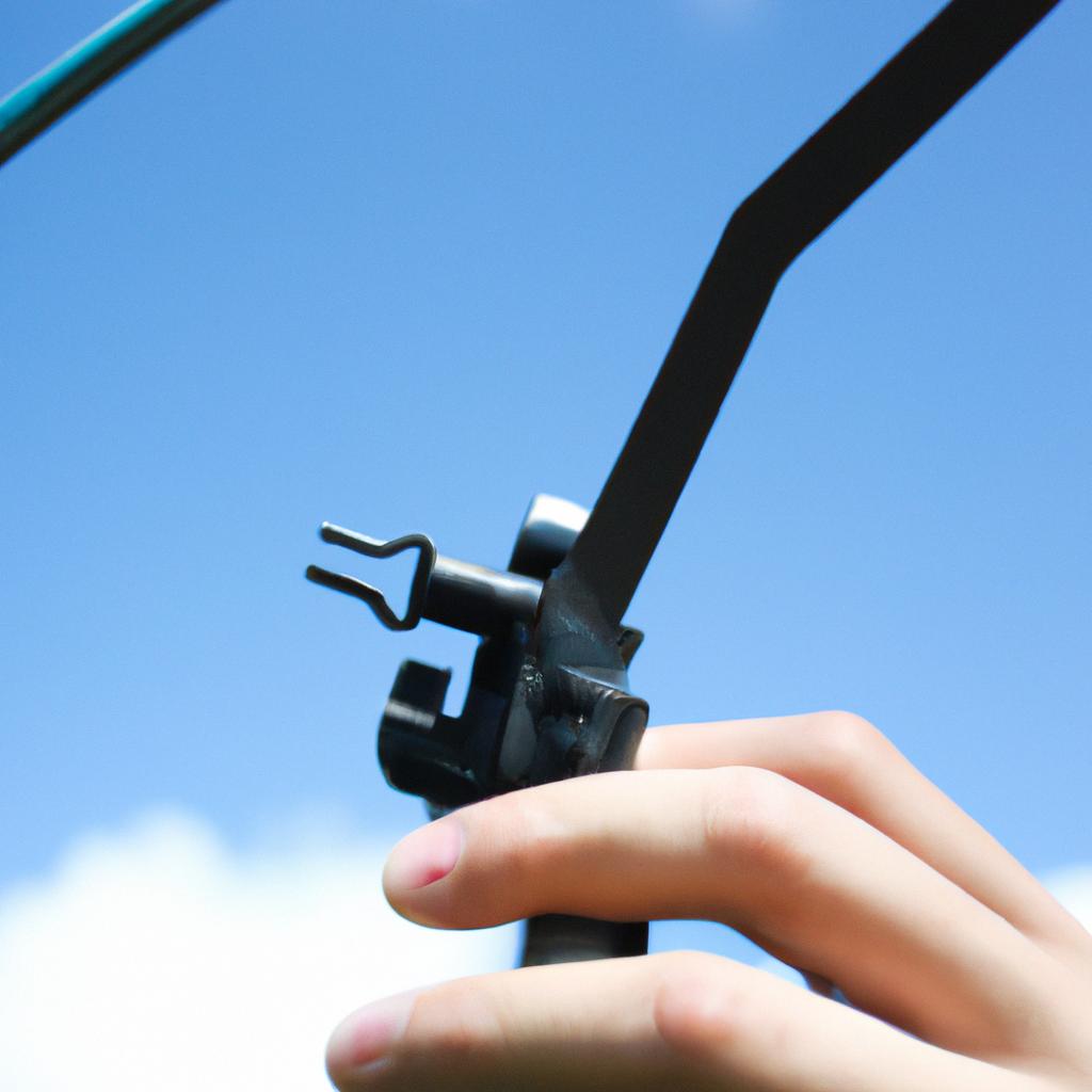 Person holding removable antenna, adjusting