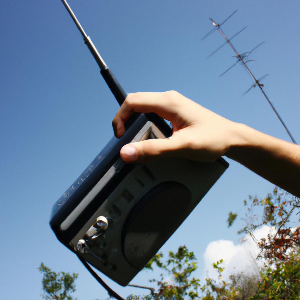 Person holding satellite radio receiver
